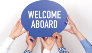 Hands holding a blue bubble in the air with white welcome aboard text in the centre 